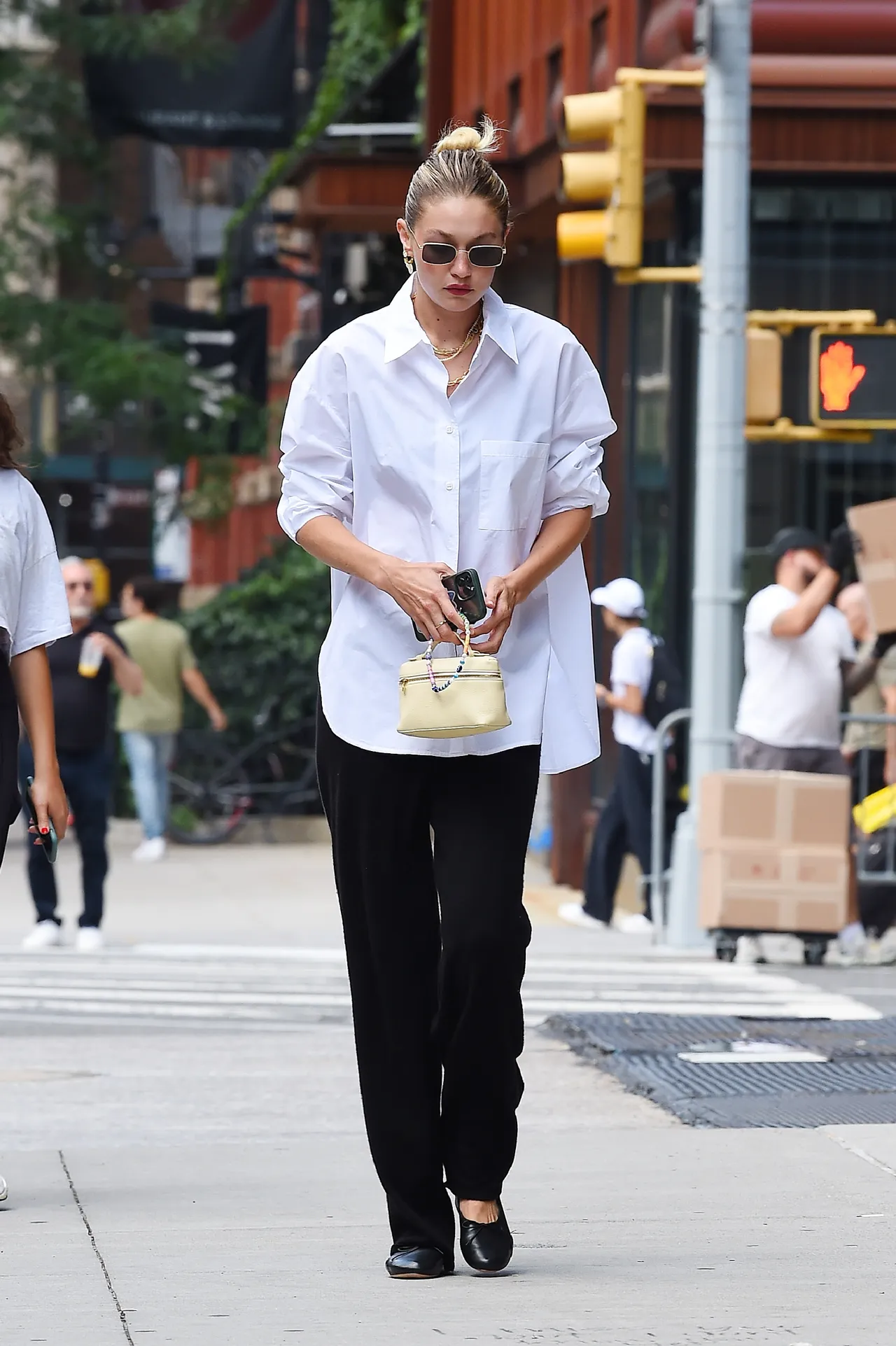 Gigi Hadid carrying Extra Pocket by Loro Piana.