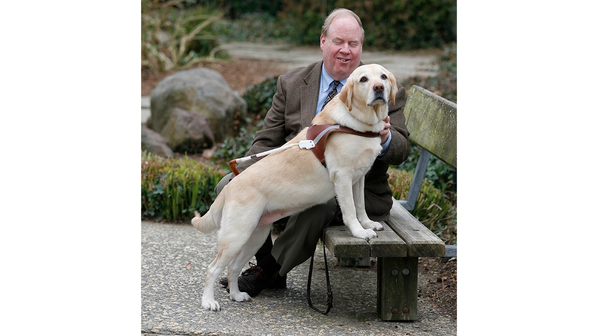 Michael Hingson with his guide dog Roselle in the early 2000s