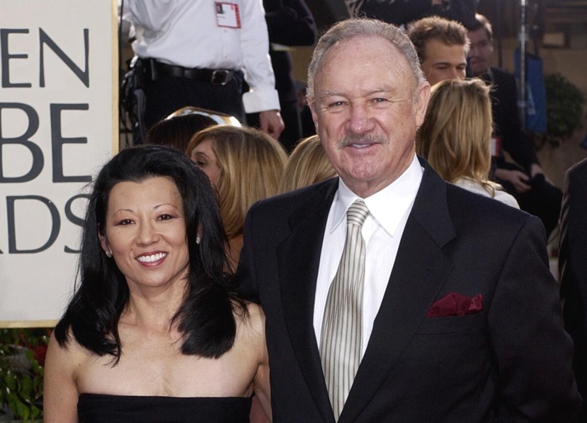 FILE - Actor Gene Hackman arrives with his wife, Betsy Arakawa.