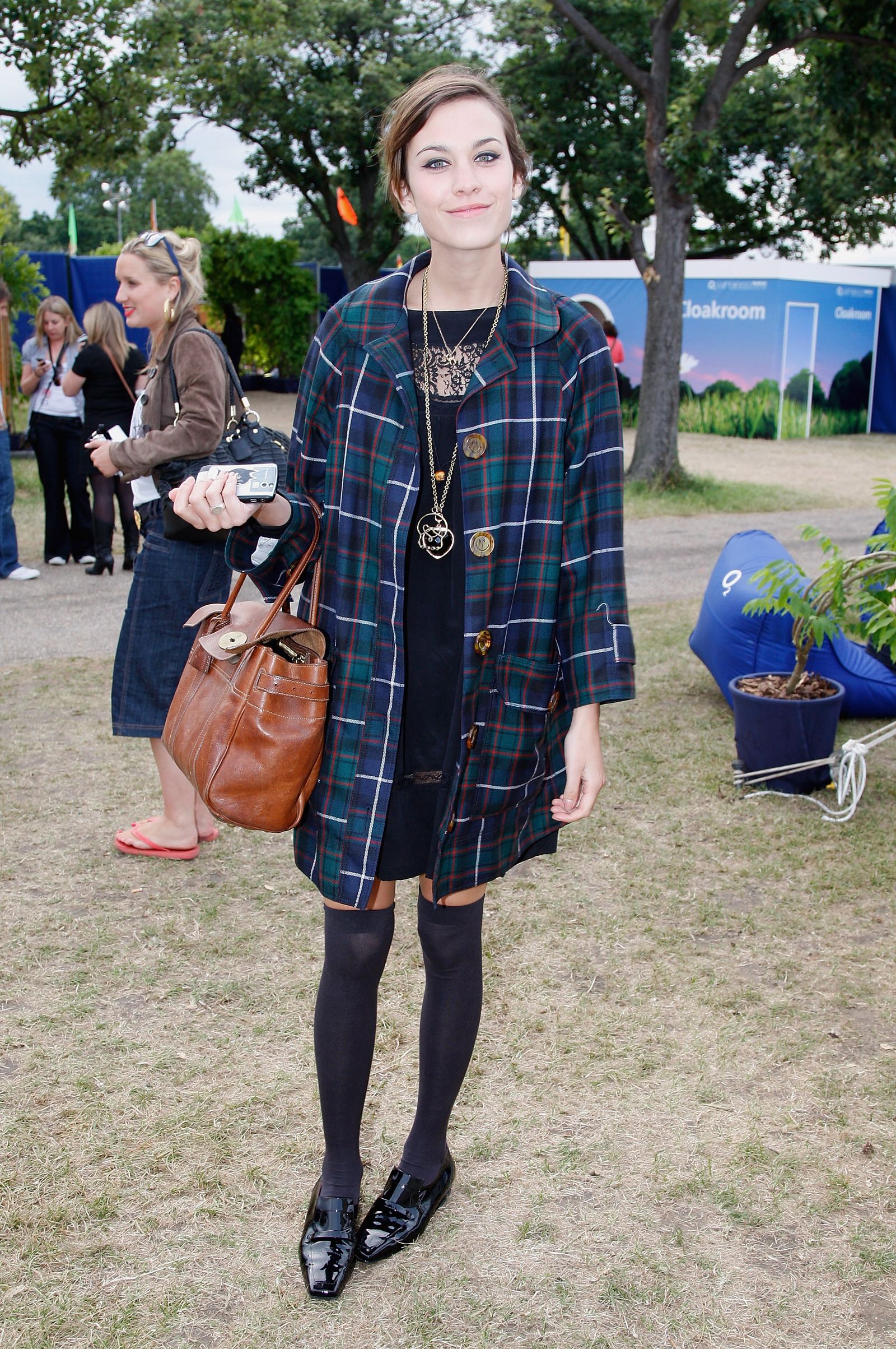 Image may contain Alexa Chung Person Accessories Bag Handbag Clothing Footwear Shoe Teen Adult Plant and Jewelry