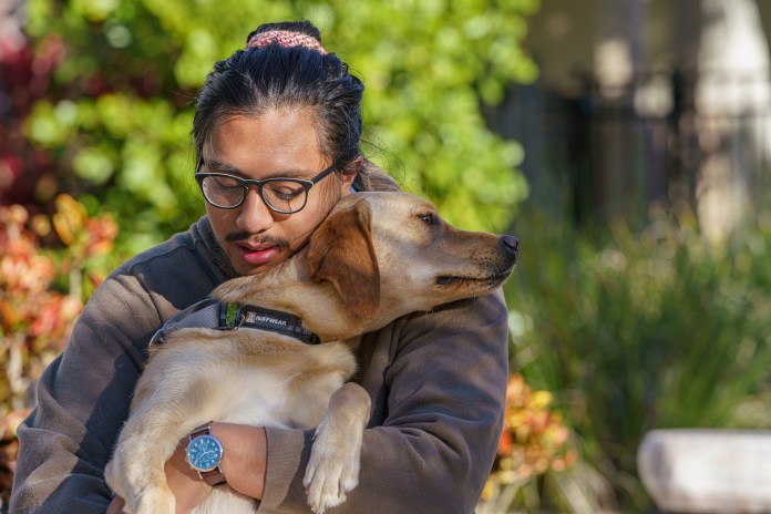 Hugging Puppy Raiser