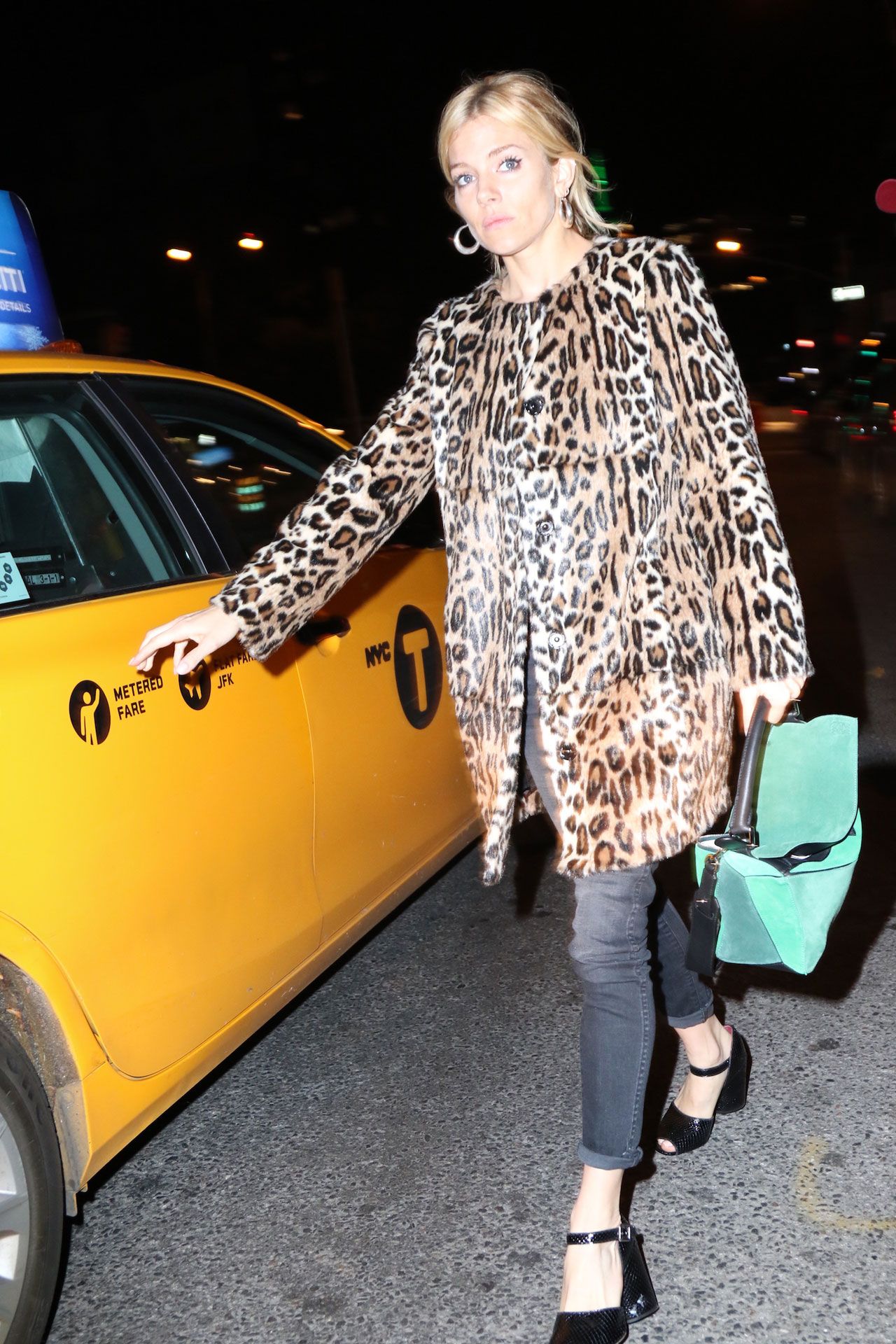 Image may contain Sienna Miller Accessories Bag Handbag Clothing Coat Footwear High Heel Shoe Adult and Person
