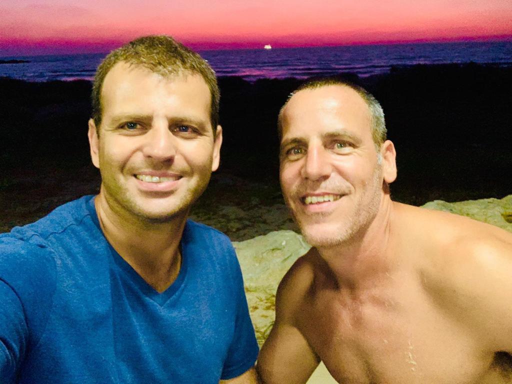 Chen Nahmias (left) with his friend Nati Azulay, who helped build a dog rescue shelter and rehabilitation center in Nahmias' memory after he was killed in the Oct. 7 attacks, in an undated photograph.