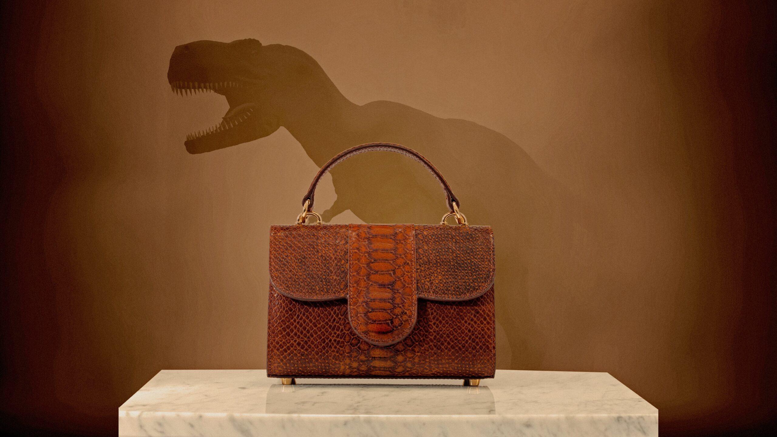 A photo collage of a crocodile leather bag in front of a T. rex illustration.