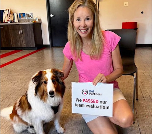 Hinsdale resident Dawn McGrath poses for a photo with Bailey after passing an evaluation as part of the therapy dog certification process. (Dawn McGrath)