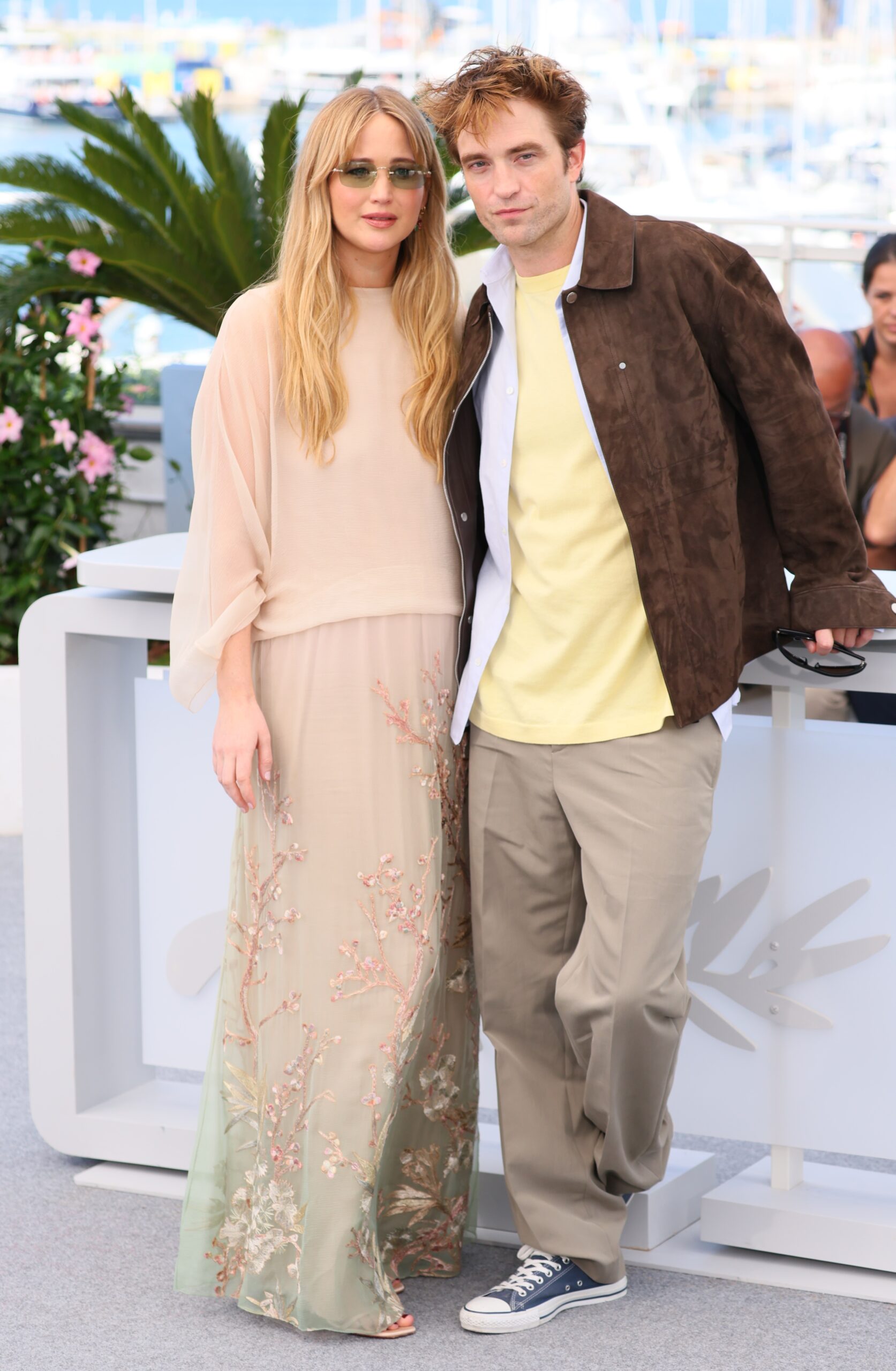 Jennifer Lawrence wears a floaty Dior outfit and carries a luxury Dior handbag for Cannes Film Festival photocall with Robert Pattinson