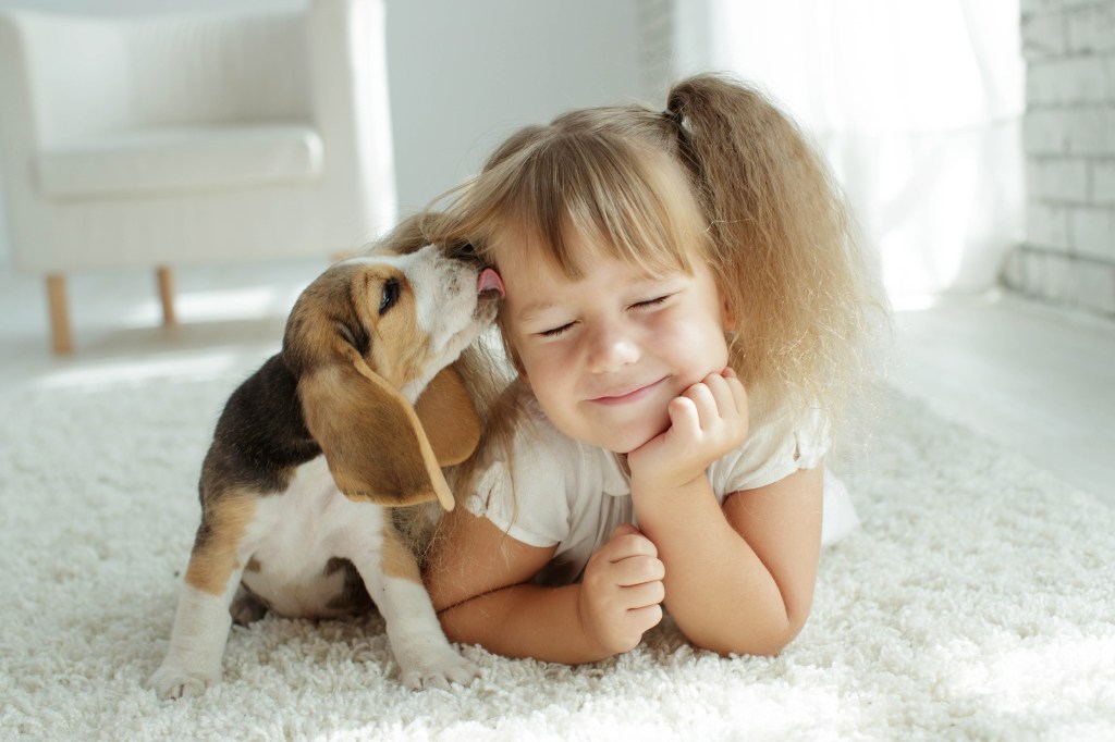 little girl and puppy