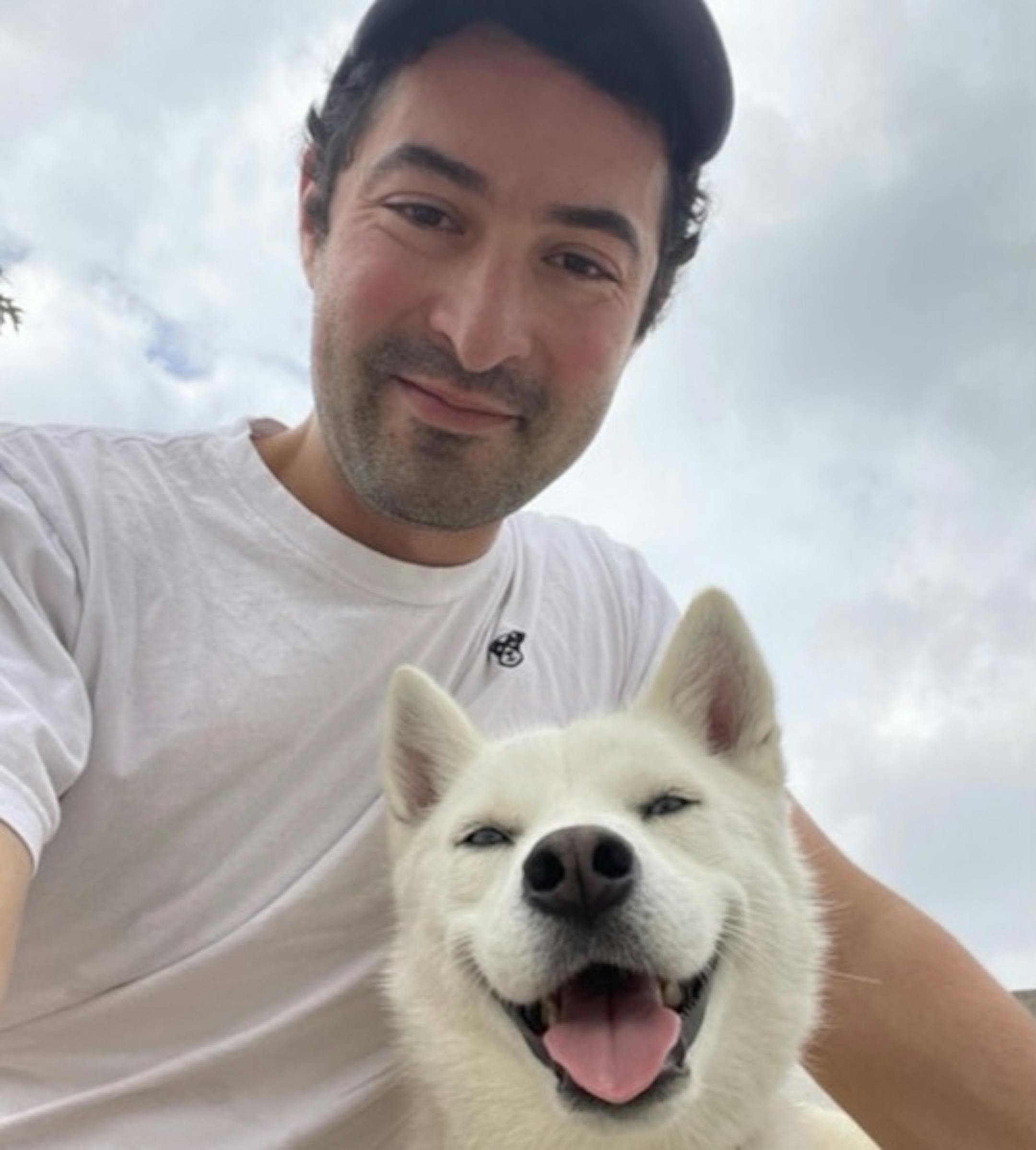 photo of author Elias Weiss Friedman and his dog Elsa