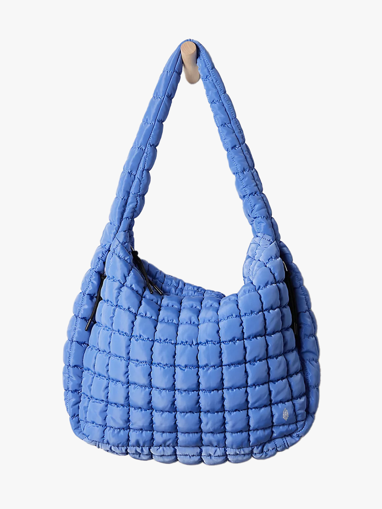 Free People Quilted Carryall Bag in branded component on a light gray background