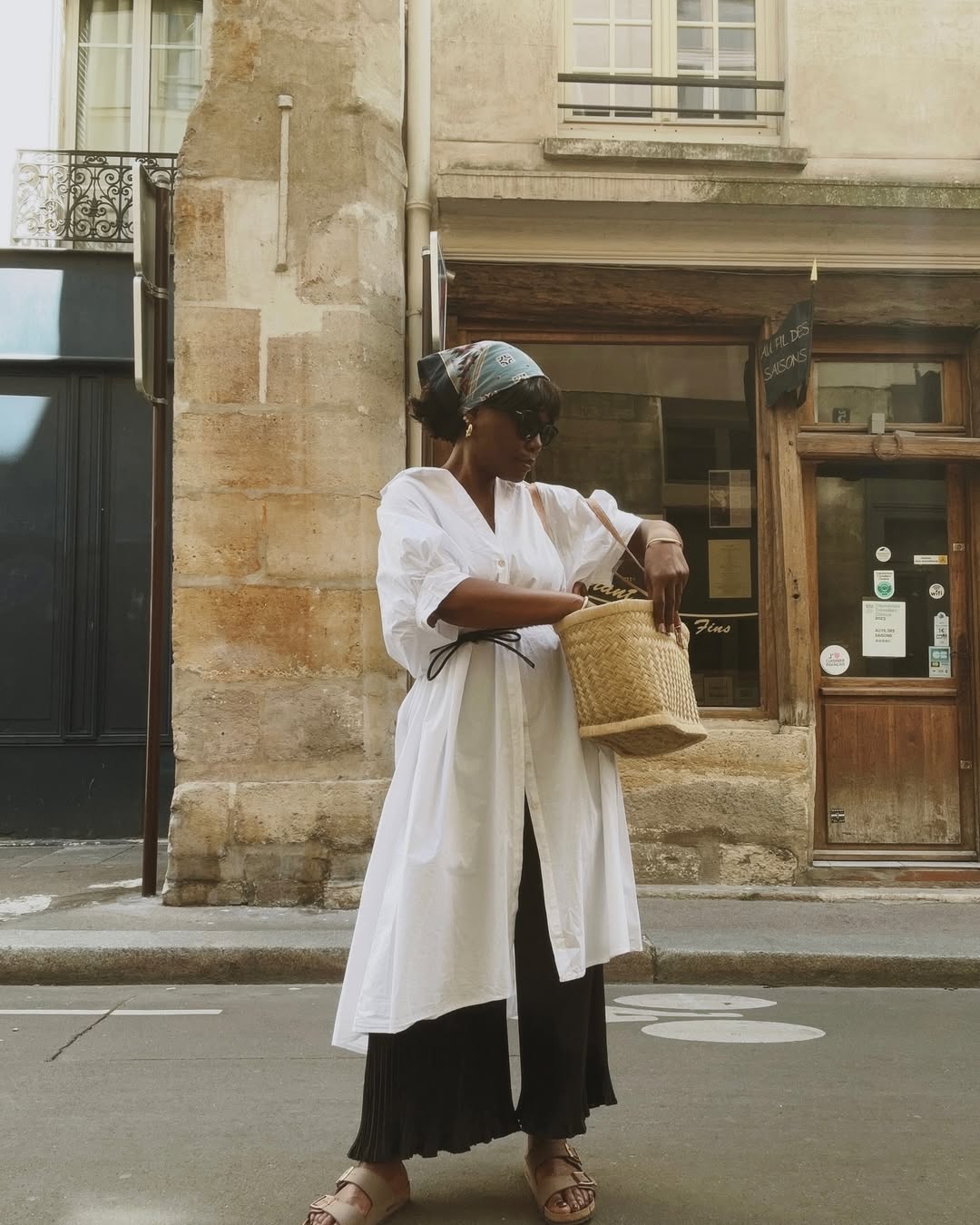 @frannfyne wearing raffia bag with white shirt dress